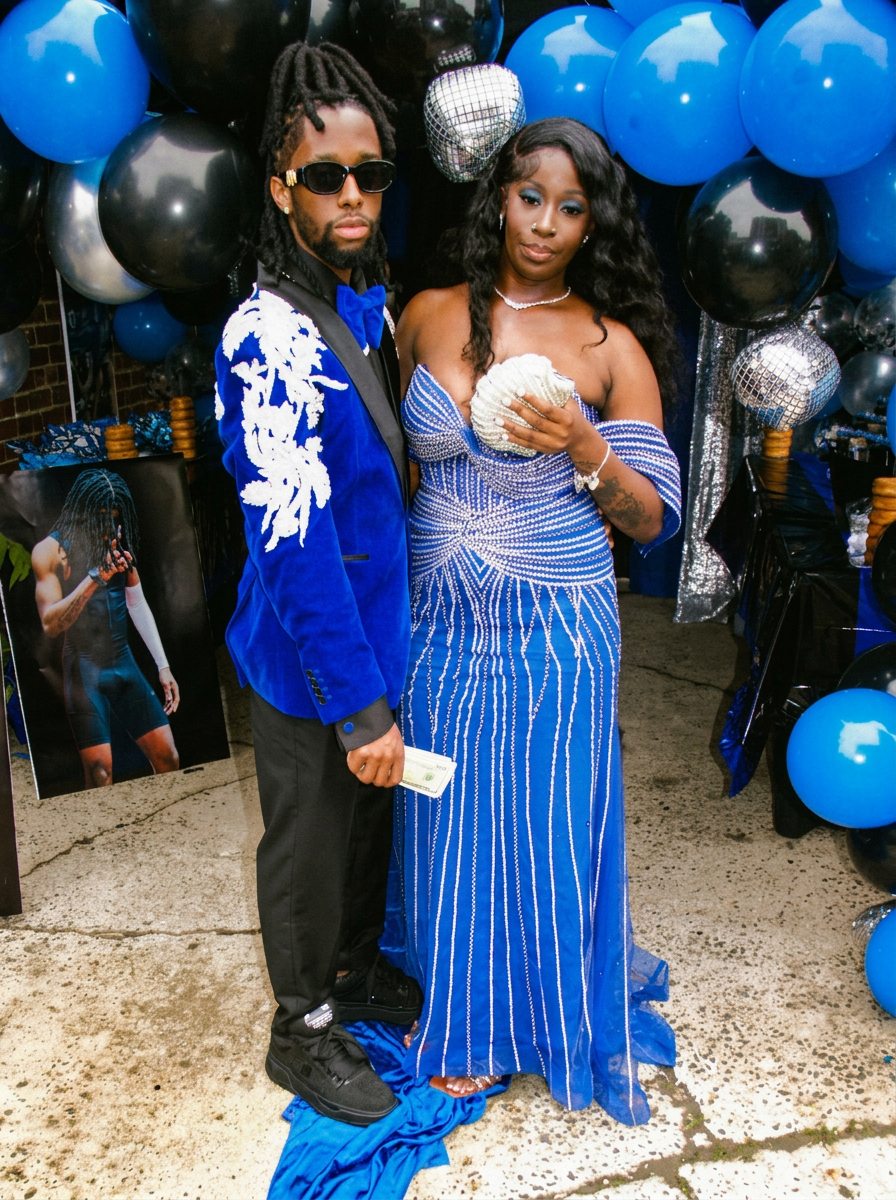 Couple in royal blue prom looks with crystal embellishment and velvet tailoring